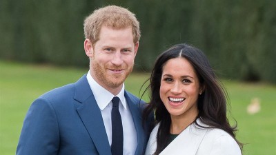 Принц Хари със своята съпруга Меган Маркъл.
